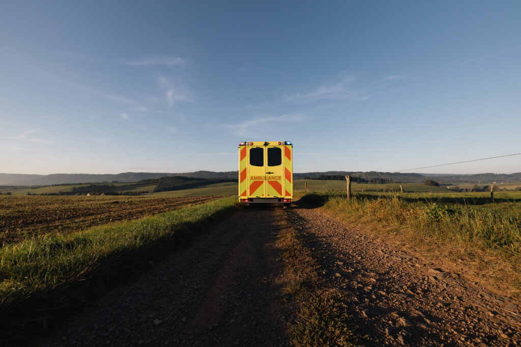 Ambulance car of emergency medical service on rural dirt road