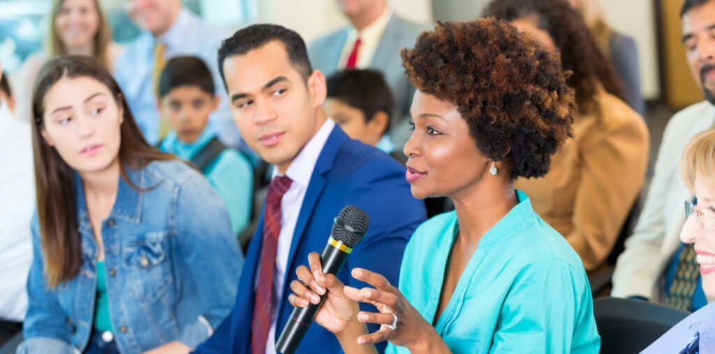 Confident African American woman asks question during a meeting